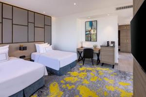 Melia Vinpearl Thanh Hoa客房内的一张或多张床位