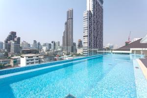 a large swimming pool on top of a building at GM Residence in Bangkok