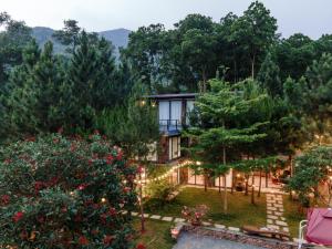 a house with a garden and a pool at LEE Garden - Venuestay in Hanoi