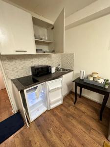 a small kitchen with a counter and a sink at Premium Studio Flat 04 in Central London in London