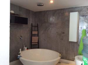 a bathroom with a large white tub in a room at La maison du bonheur à samui in Koh Samui +27 photos