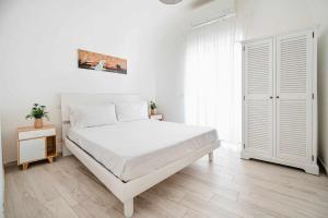 A bed or beds in a room at White Amalfi Centro Storico by ItalianHost