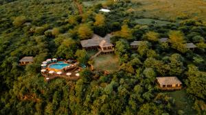 an aerial view of a mansion with a swimming pool at Escarpment Luxury Lodge Manyara in Mto wa Mbu