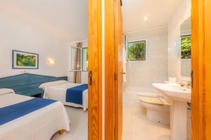 A bed or beds in a room at Oro Del Mar iv Apartamento 02