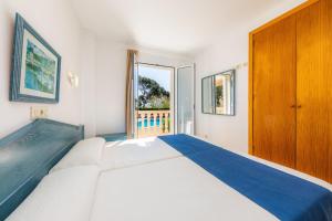 A bed or beds in a room at Oro Del Mar iv Apartamento 02