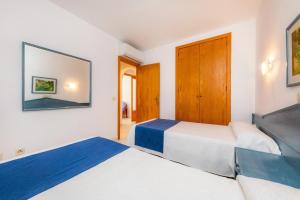 A bed or beds in a room at Oro Del Mar iv Apartamento 02
