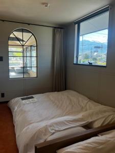Postel nebo postele na pokoji v ubytování KIIIYA cafe&hostel + 37 fotografií