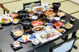 a table with a bunch of food on it at glampark Shikisou Shimane in Izumo