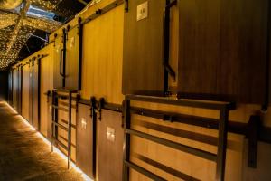 a row of stalls in a building with wooden walls at Cinema Capsules in Jerusalem