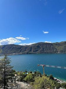 a large body of water with a train on it at Monolocale con vista lago in Campione dʼItalia