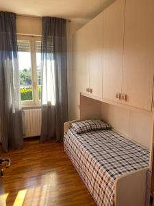 En eller flere senge i et værelse på Appartamento San Michele