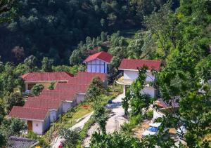 an overhead view of a group of houses with red roofs at Skywood Resort Shoghi in Shogi
