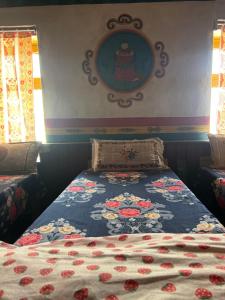 Voodi või voodid majutusasutuse Hotel Dancing Yak toas