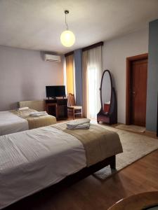 Postel nebo postele na pokoji v ubytování Guesthouse Bimbli