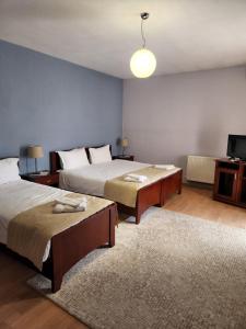 Postel nebo postele na pokoji v ubytování Guesthouse Bimbli