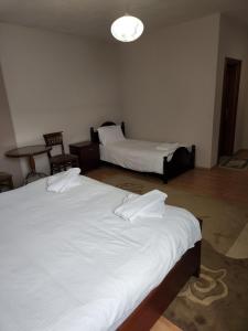 Postel nebo postele na pokoji v ubytování Guesthouse Bimbli