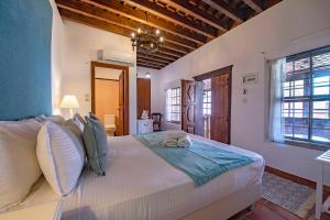 a bedroom with a large bed in a room at Saint Artemios Boutique Hotel in Rhodes Town