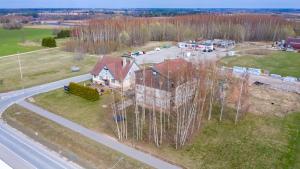 an aerial view of a house in the woods at Kambja kodud in Myza Kambʼya