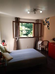 En eller flere senger på et rom på n6 appartement de Vacancorse Maison U Canale