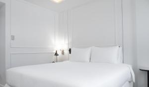 Postel nebo postele na pokoji v ubytování Hotel Tano Guam