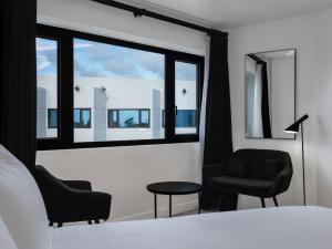 Postel nebo postele na pokoji v ubytování Hotel Tano Guam