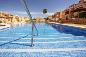 The swimming pool at or close to ALTOS DEL SOL by United Renters