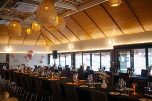 a conference room with a long table and chairs at Ruknam Resort in Ban Hin Hak