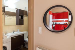 a bathroom with a sink and a mirror at City Suite in Kefalonia in Argostoli