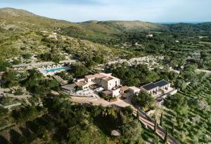 an aerial view of a resort with a pool at Cases de Son Barbassa Hotel & Restaurant in Capdepera