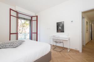 Llit o llits en una habitació de Appartamento Rossini - Volta 4