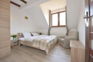 Postel nebo postele na pokoji v ubytování Poduszka Apartamenty Zielony Dom