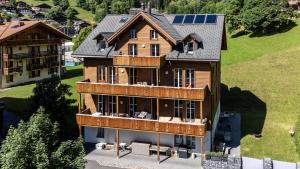 an aerial view of a house with a roof at Le Manoir 1 Studio in Wengen
