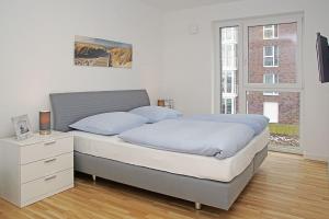 Кровать или кровати в номере Haus Marina 28
