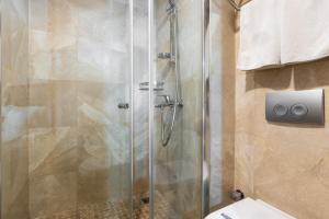 a shower with a glass door in a bathroom at 6 Apartment Galata in Istanbul +25 photos