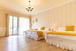 Postel nebo postele na pokoji v ubytování Flower Happiness Homestay