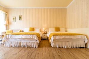 Postel nebo postele na pokoji v ubytování Flower Happiness Homestay