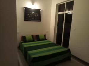 Postel nebo postele na pokoji v ubytování Nilwala Gate wetland Stay
