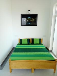 Postel nebo postele na pokoji v ubytování Nilwala Gate wetland Stay