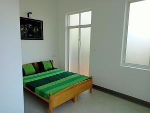 Postel nebo postele na pokoji v ubytování Nilwala Gate wetland Stay
