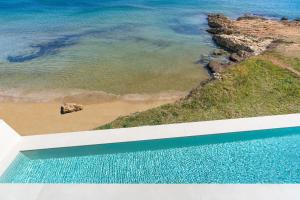 a view of the beach and the ocean from a building at Bedda Matri in Noto