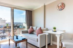 a living room with a couch and a table at 6 Apartment Galata in Istanbul