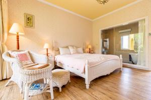 Postel nebo postele na pokoji v ubytování Flower Happiness Homestay
