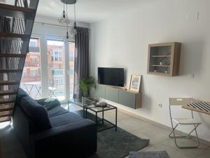 TV a/nebo společenská místnost v ubytování Love Rent4 Málaga loft