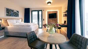 Postel nebo postele na pokoji v ubytování Nena Apartments SPREEblau