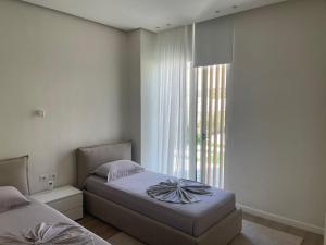 Ένα ή περισσότερα κρεβάτια σε δωμάτιο στο Villa 60 b - Palasë