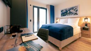 Postel nebo postele na pokoji v ubytování Nena Apartments SPREEblau