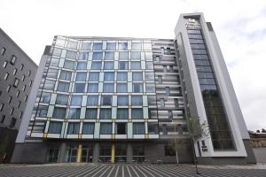 an office building with a lot of windows at Holiday Inn Express Manchester City Centre Arena by IHG in Manchester