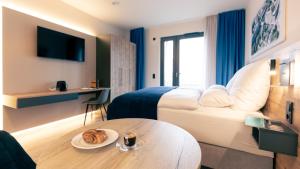 Postel nebo postele na pokoji v ubytování Nena Apartments SPREEblau