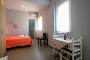 Postel nebo postele na pokoji v ubytování Pavlina's Apartments 1