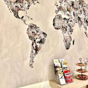 a map of the world on a wall at B&B Bovio Square XIV in Naples